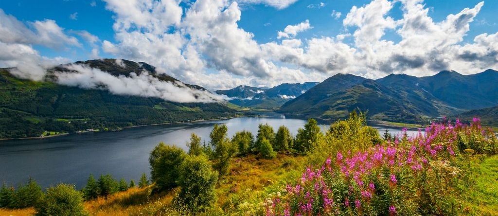 Early morning at Loch Duich in the Highlands of Scotland with low lying clouds and mountain views