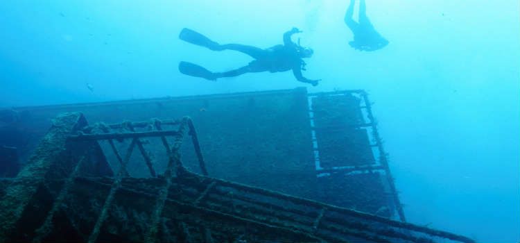 Scuba dive an underwater shipwreck
