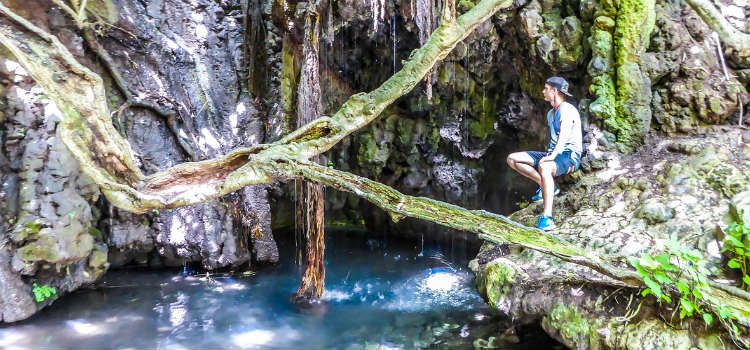 Waterfall cascades into the Adonis Baths