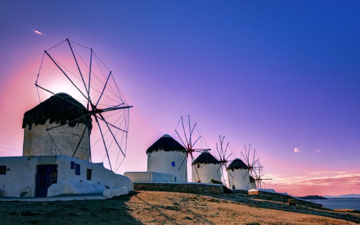 Windmills at a pink sunset