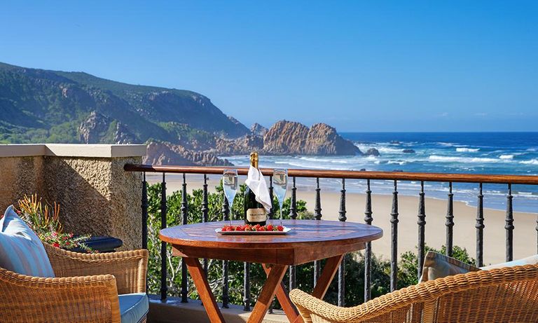 balcony, with table chairs, and prosecco looking out to Knysna, South Africa
