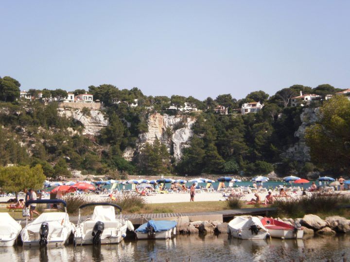 Boats and beach in Es Migjorn Gran