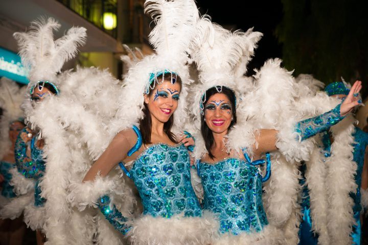 Two women in headdresses at Sitges carnival