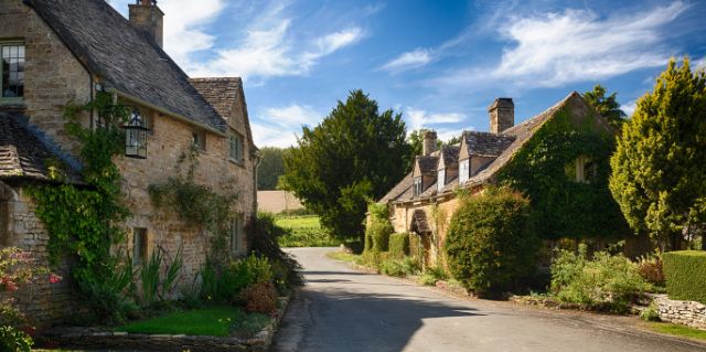 Street of old houses in the Cotswolds UK