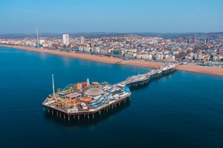 Brighton Palace Pier stretching into the sea from Brighton Beach