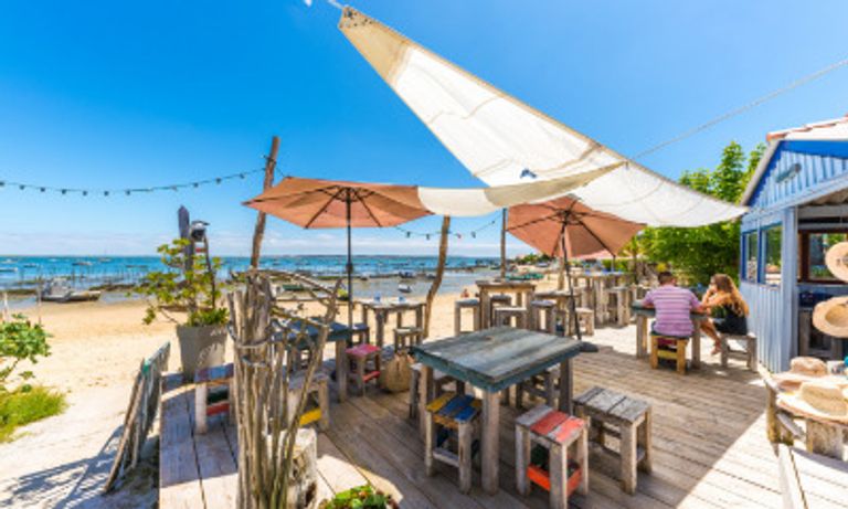 Beach bar leading onto beach in France