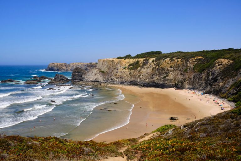 Beach And Cliff At Praia Do Carvalhal.