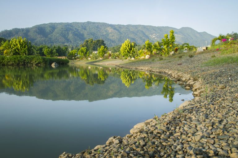 Lake amongst the trees and mountains in tropical landscape in the Dominican Republic