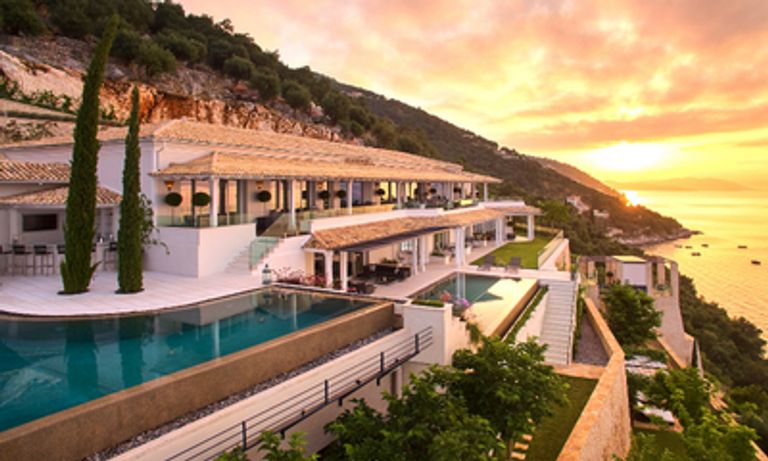 View on mountain edge at sunset with pool