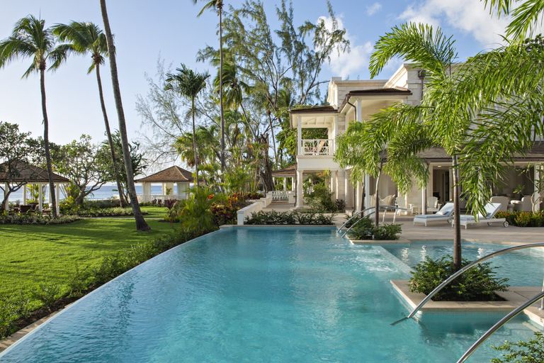villa with greenery and pool in barbados