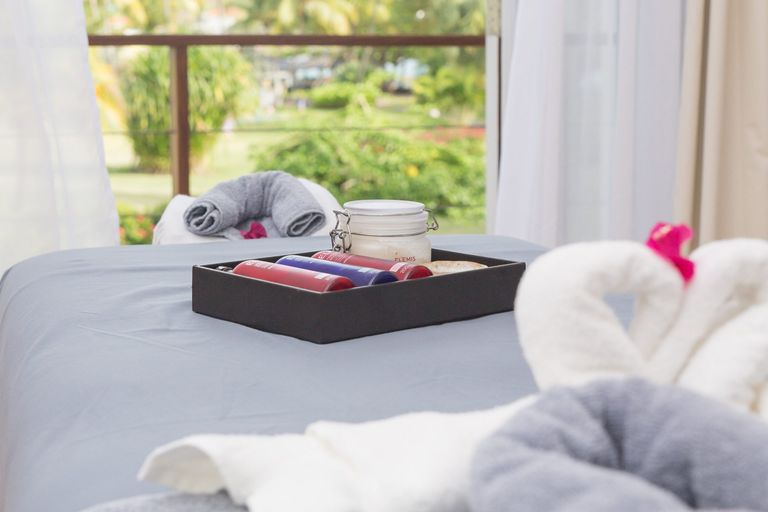 Spa bed with elemis products and towels