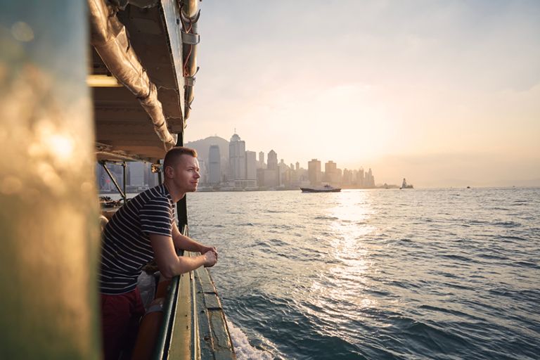 Man looking out on a ferry