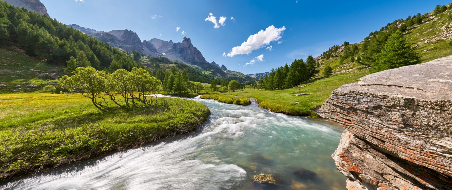 River running through the mountains in Summer