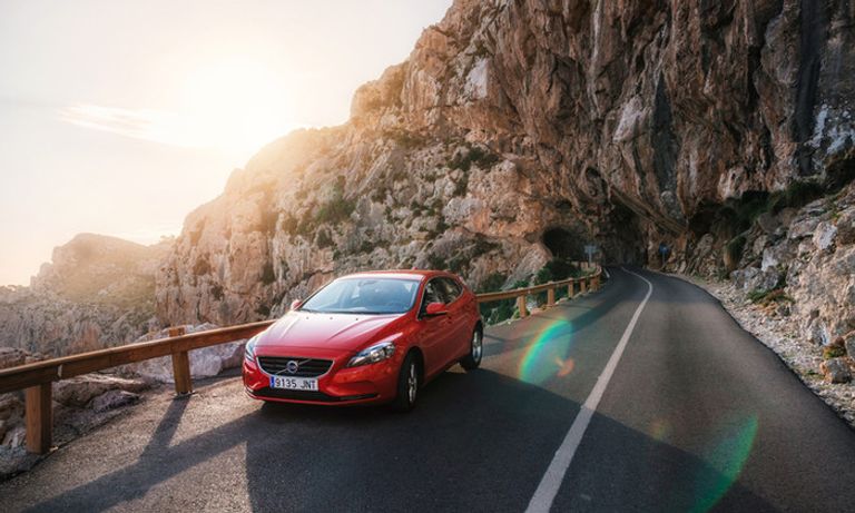 Car driving on a cliff edge