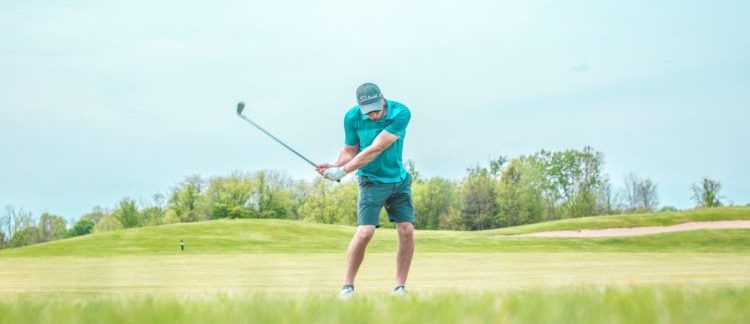 man playing golf on course