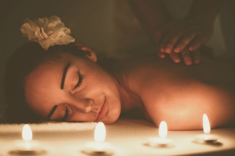 Woman during a massage treatment in spa.
