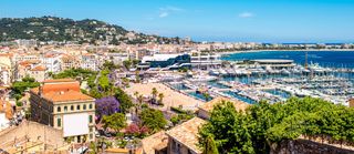 Top cityscape view on french riviera with yachts in Cannes city