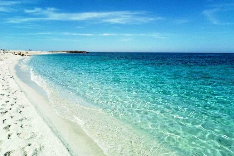 beaches in sardinia | white sand beach and blue water under clear sky | is aruttas