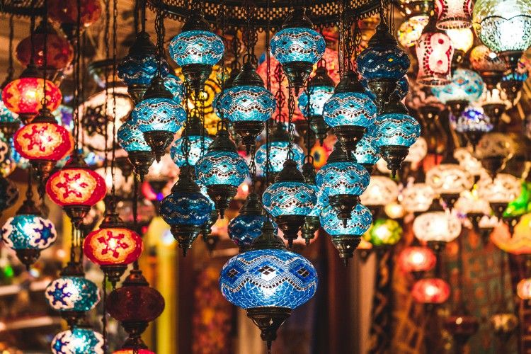 Amazing traditional handmade turkish lamps in souvenir shop. Mosaic of colored glass. Lit in the evening, creating a cozy atmosphere