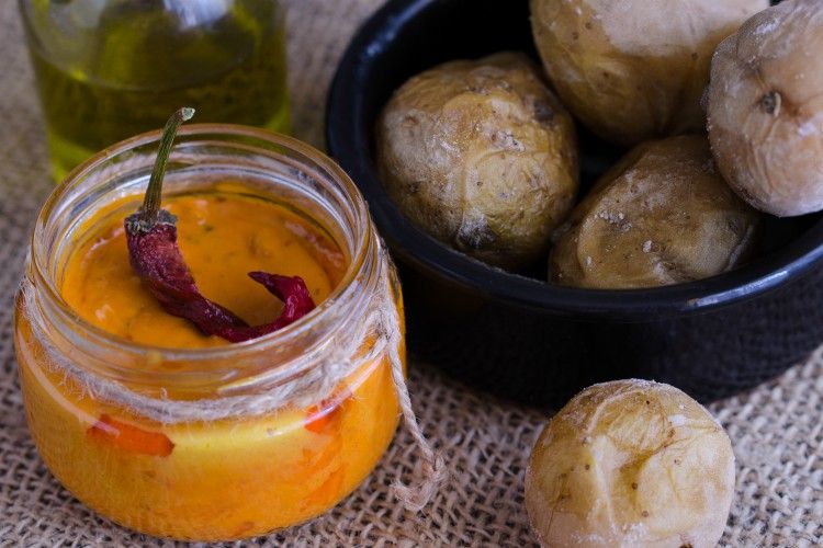 Local Canary Islands dish, Papas Arrugadas (wrinkly potatoes) with Mojo picon (red sauce).