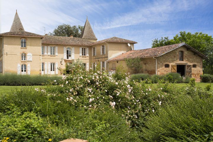 Exterior of ancient chateau gardens with chateau in the background