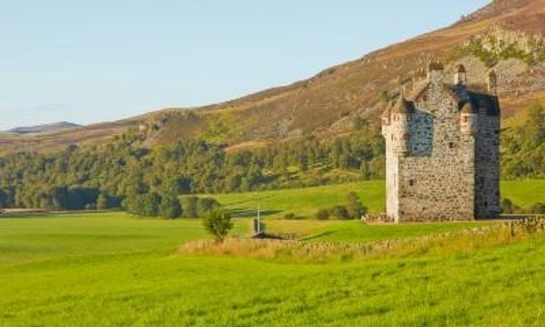 field with castle in Scotland