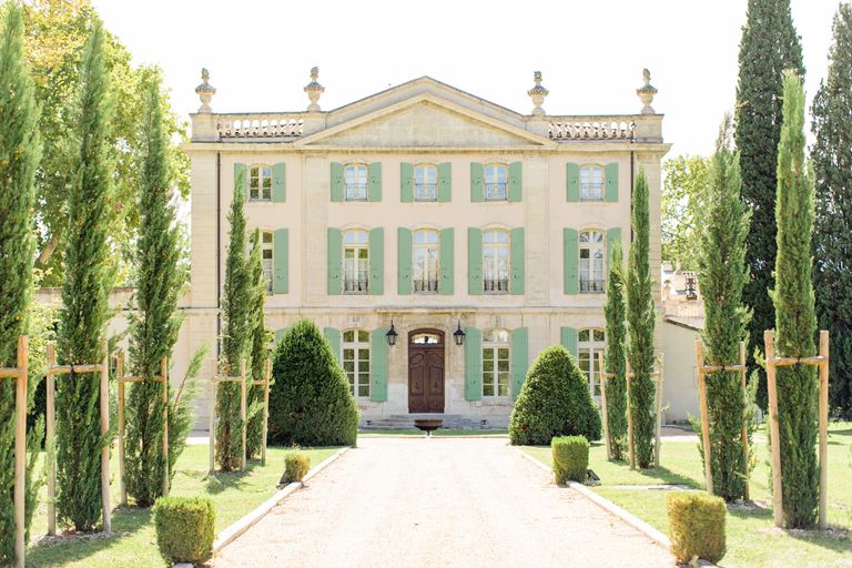 18th century chateau with trees at the entrance