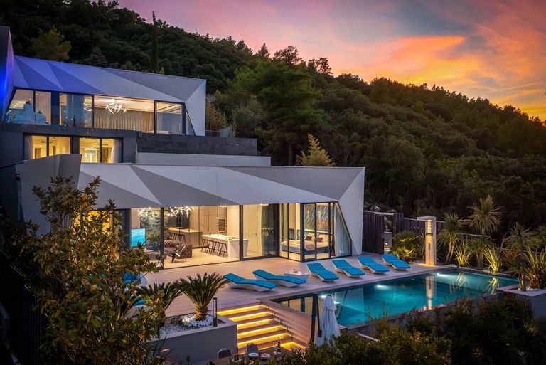 Ultra modern villa with pool at sunset