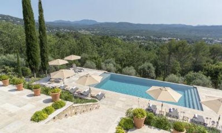 Outdoor pool, with umbrellas, in the French hills